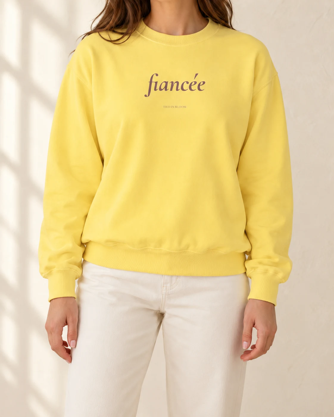 AI mockup of a woman wearing The Fiancée Crew in Butter, cropped below the face.