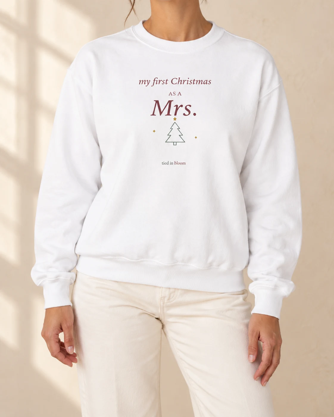AI mockup of a woman wearing First Christmas as Mrs in White, cropped below the face.