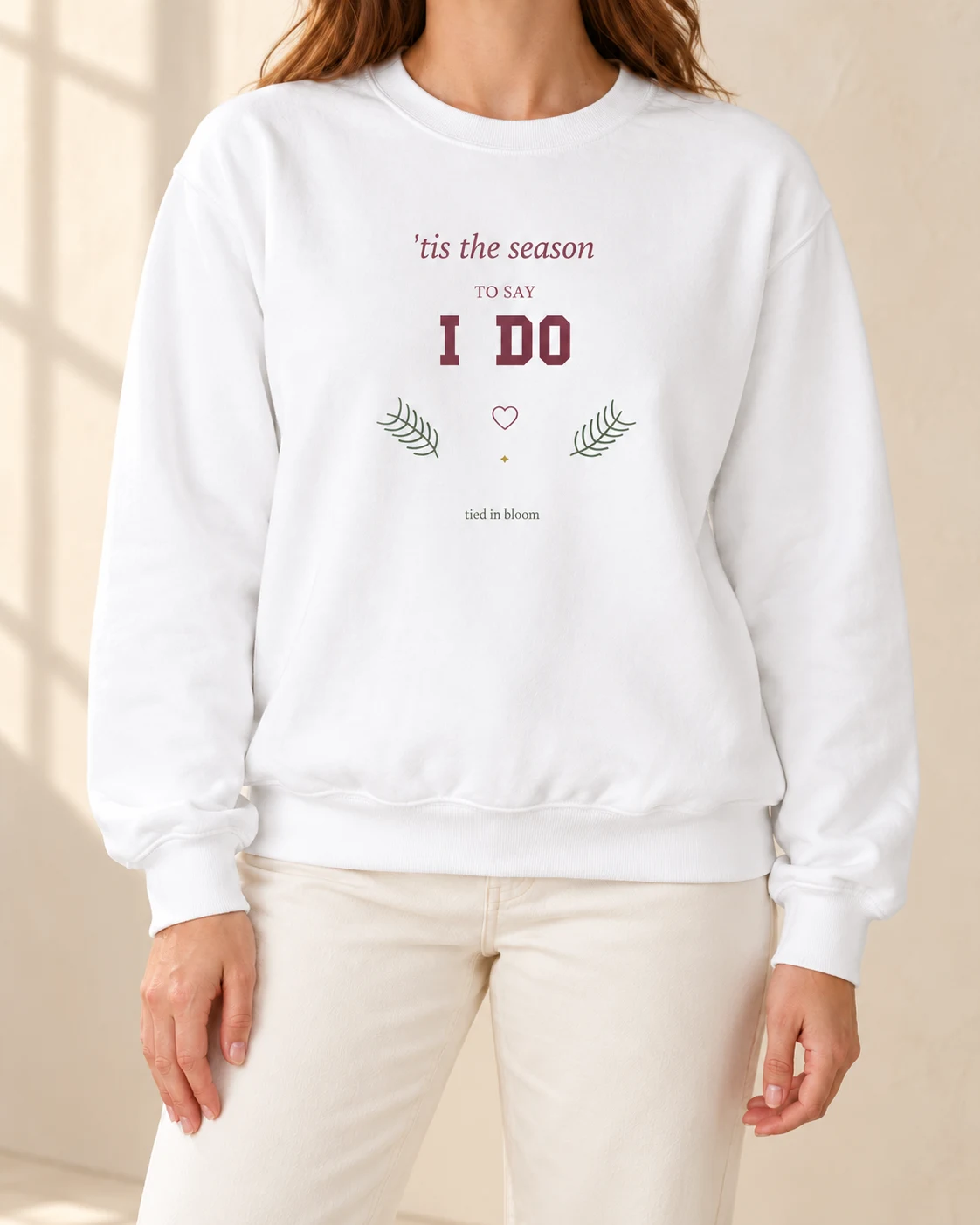AI mockup of a woman wearing The Season to Say I Do in White, cropped below the face.